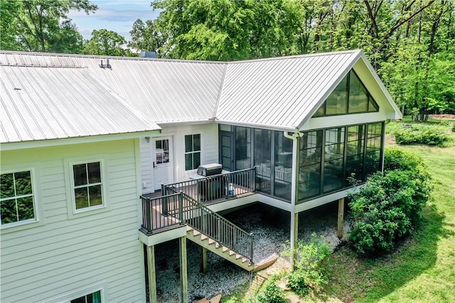 224 Edgewood Dr, Seneca, SC 29678 - rear view of house featuring a sunroom, stairway, and a metal roof
