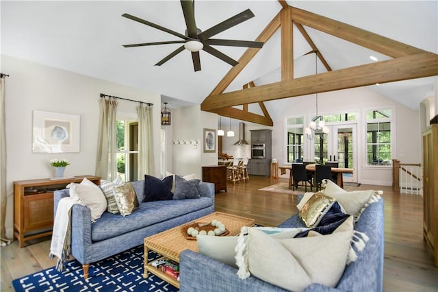 224 Edgewood Dr, Seneca, SC 29678 - living area featuring high vaulted ceiling, a ceiling fan, a chandelier, light wood-type flooring, and beamed ceiling