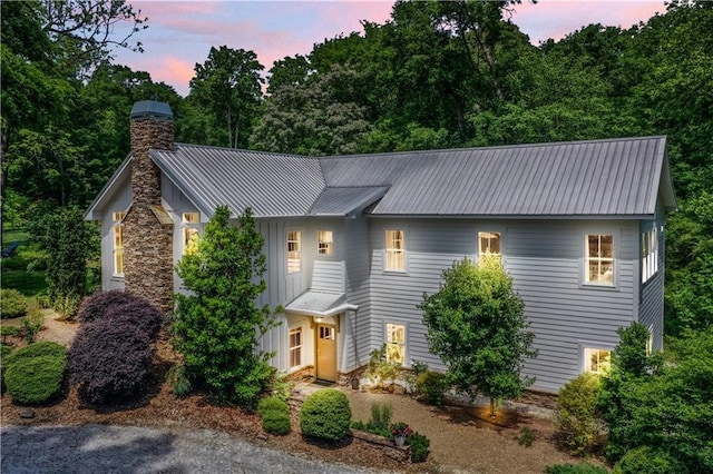 224 Edgewood Dr, Seneca, SC 29678 - view of front of house featuring a chimney, a metal roof, and board and batten siding