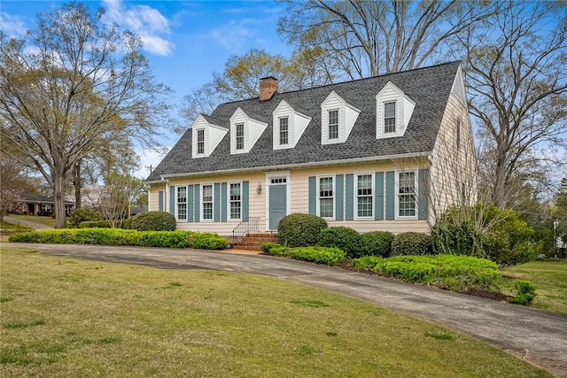 401 Berkshire Hl, Anderson, SC 29621 - new england style home with a chimney, a front lawn, and roof with shingles