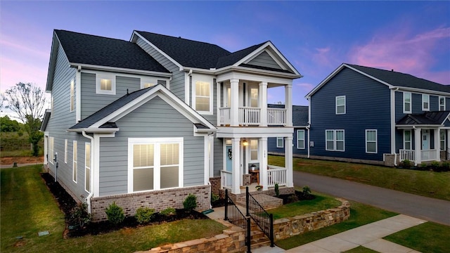 109 Founders Blvd, Central, SC 29630 - view of front of home featuring covered porch, a balcony, brick siding, a shingled roof, and a yard