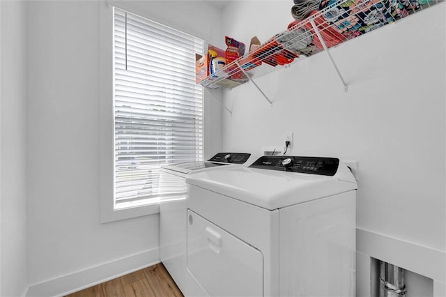 109 Founders Blvd, Central, SC 29630 - laundry area featuring washing machine and clothes dryer, light wood-style floors, and baseboards