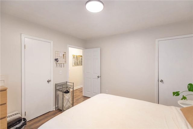bedroom featuring wood finished floors