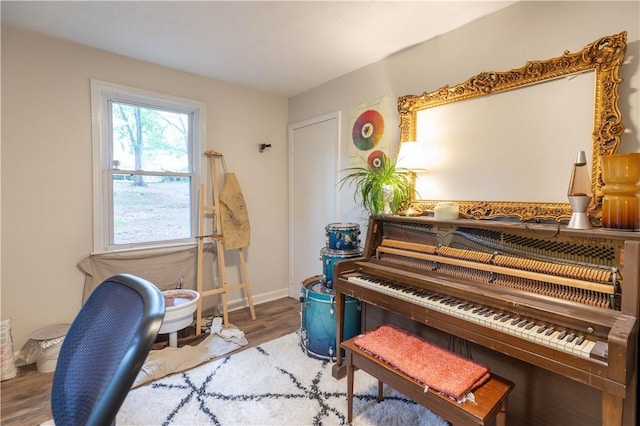 sitting room with wood finished floors and baseboards
