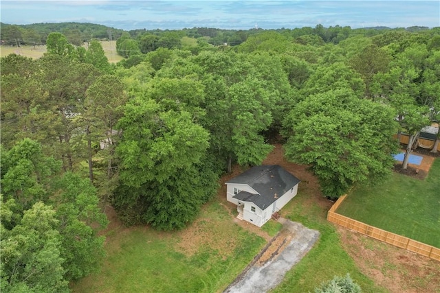 aerial overview of property's location featuring a forest
