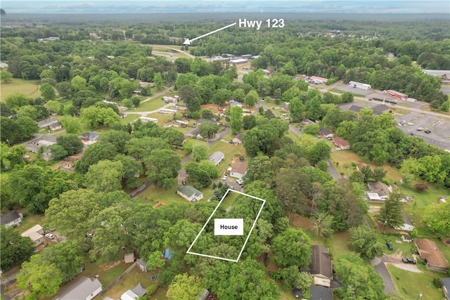 view of property location with property parcel outlined and a heavily wooded area