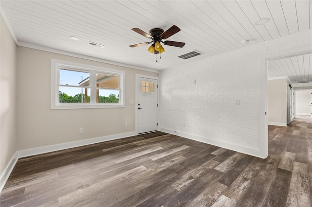 101 Fairview Dr, Greenville, SC 29609 - unfurnished living room with wooden ceiling, brick wall, baseboards, a ceiling fan, and dark wood finished floors