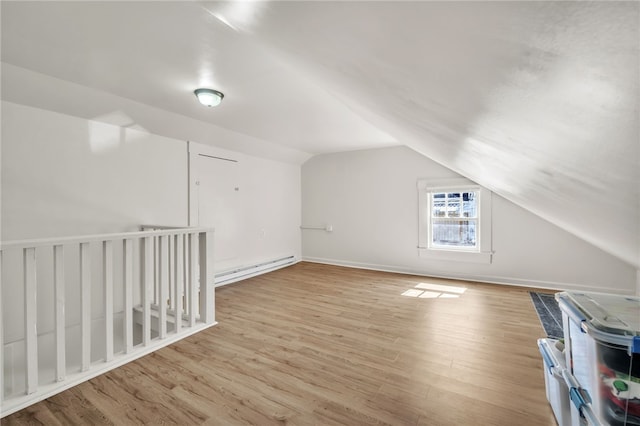 60 N Humphrey St, Inman, SC 29349 - additional living space with vaulted ceiling, wood finished floors, and a baseboard heating unit