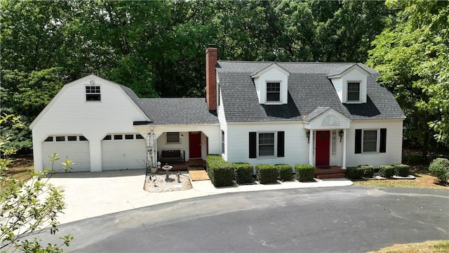 1211 Manse Jolly Rd, Anderson, SC 29621 - colonial inspired home with driveway, a chimney, roof with shingles, a garage, and view of wooded area