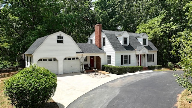 1211 Manse Jolly Rd, Anderson, SC 29621 - colonial inspired home featuring driveway, a garage, a chimney, a shingled roof, and a gambrel roof