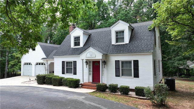 1211 Manse Jolly Rd, Anderson, SC 29621 - view of front of home featuring a chimney, central air condition unit, driveway, an attached garage, and a shingled roof