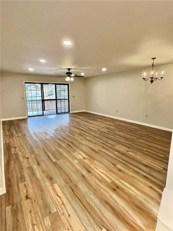 2153 Shea Ln, Seneca, SC 29672 - unfurnished living room featuring light wood-style flooring, recessed lighting, baseboards, a chandelier, and ceiling fan