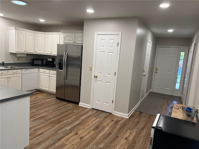 2153 Shea Ln, Seneca, SC 29672 - kitchen featuring stainless steel fridge, dishwasher, black microwave, a sink, and white cabinetry