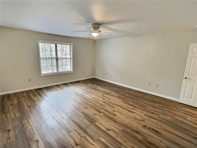 2153 Shea Ln, Seneca, SC 29672 - spare room with a ceiling fan, dark wood-style floors, and baseboards