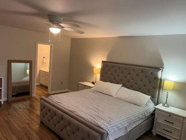2153 Shea Ln, Seneca, SC 29672 - bedroom with dark wood-type flooring, a ceiling fan, baseboards, and connected bathroom