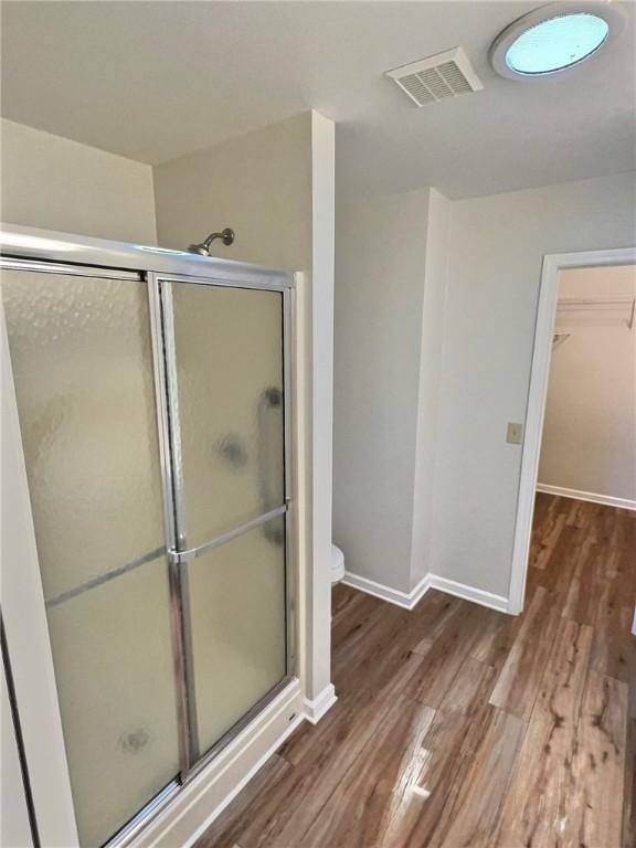 2153 Shea Ln, Seneca, SC 29672 - bathroom with a shower stall, wood finished floors, and baseboards