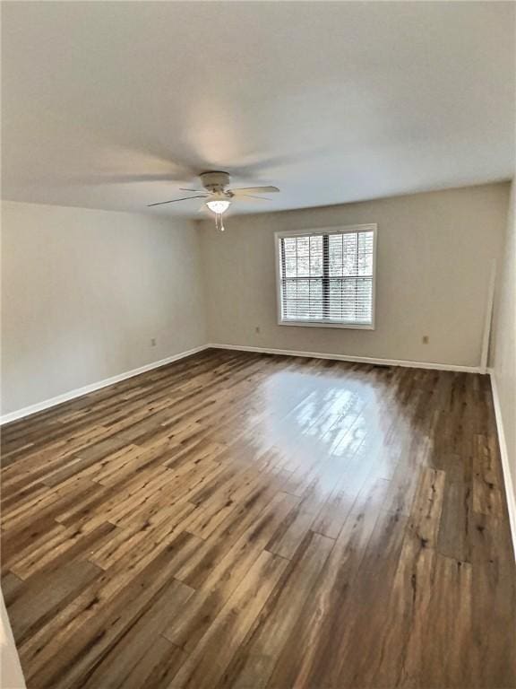 2153 Shea Ln, Seneca, SC 29672 - spare room with dark wood finished floors, a ceiling fan, and baseboards