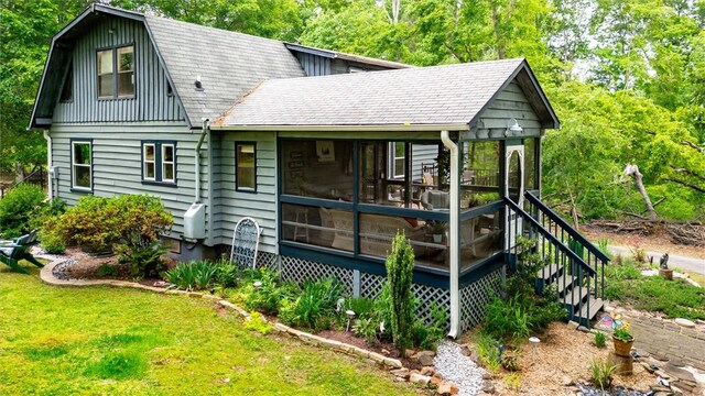 220 Family Dr, Seneca, SC 29678 - back of property featuring a sunroom, a lawn, and a shingled roof