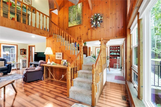220 Family Dr, Seneca, SC 29678 - stairway with wooden walls, a towering ceiling, and wood finished floors