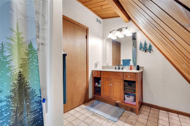 220 Family Dr, Seneca, SC 29678 - full bath with wood ceiling, tile patterned flooring, vanity, curtained shower, and baseboards