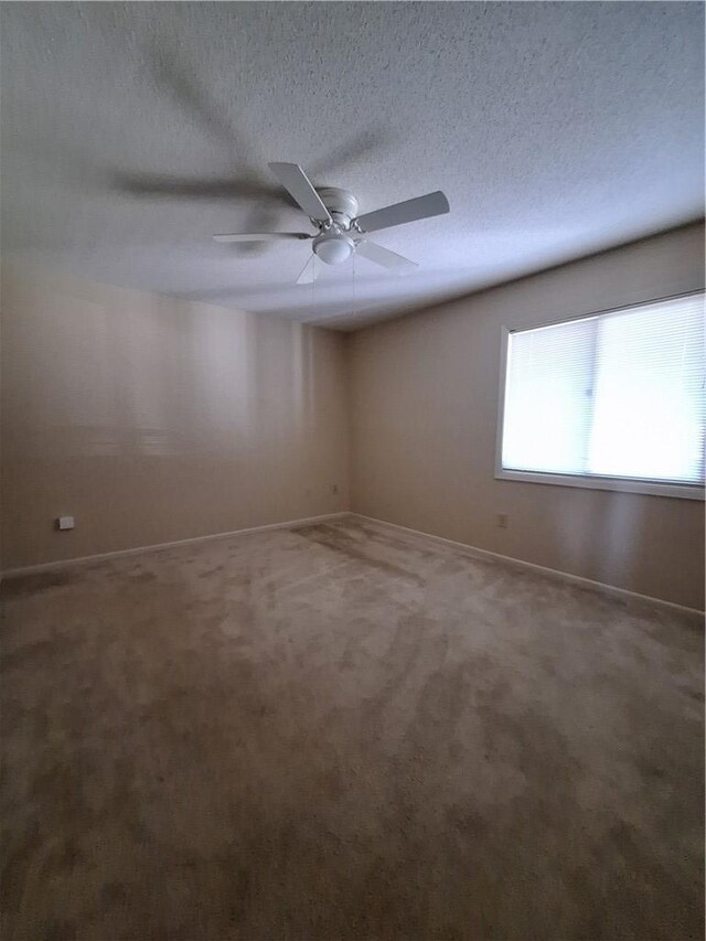 407 Northlake Dr, Anderson, SC 29625 - spare room featuring carpet floors, baseboards, a ceiling fan, and a textured ceiling