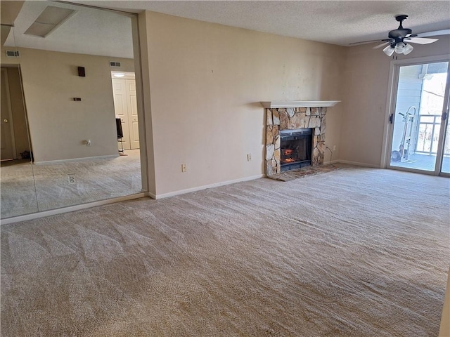 407 Northlake Dr, Anderson, SC 29625 - unfurnished living room with carpet, a ceiling fan, a fireplace, a textured ceiling, and baseboards