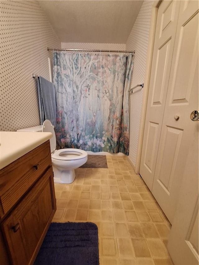 407 Northlake Dr, Anderson, SC 29625 - full bath with toilet, curtained shower, vanity, wallpapered walls, and tile patterned floors