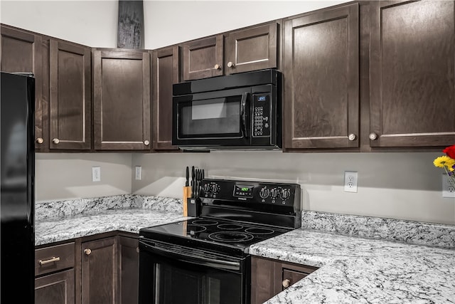 600 Brook St, Honea Path, SC 29654 - kitchen with black appliances, dark brown cabinetry, and light stone countertops