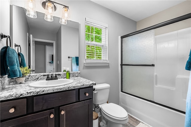 600 Brook St, Honea Path, SC 29654 - full bathroom featuring vanity, combined bath / shower with glass door, and wood finished floors