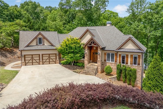 503 Greystoke Cv, Seneca, SC 29678 - craftsman-style house with stone siding, driveway, a shingled roof, and a chimney
