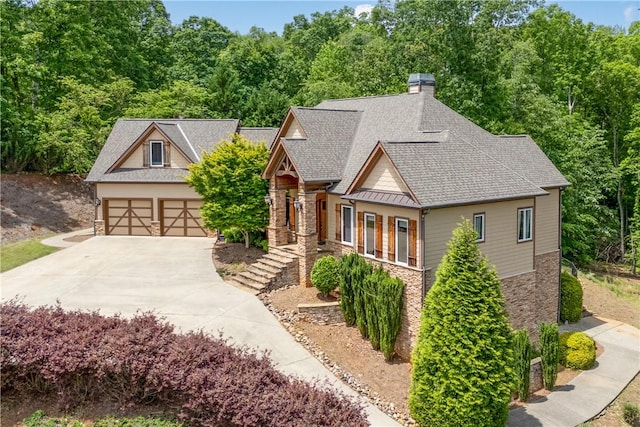 503 Greystoke Cv, Seneca, SC 29678 - craftsman inspired home featuring stone siding, roof with shingles, a chimney, and a detached garage