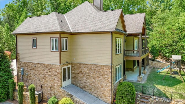 503 Greystoke Cv, Seneca, SC 29678 - back of house featuring a chimney, a patio, a playground, and a shingled roof