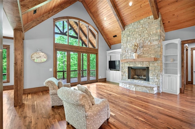 503 Greystoke Cv, Seneca, SC 29678 - living room with wooden ceiling, wood-type flooring, a stone fireplace, baseboards, and beamed ceiling