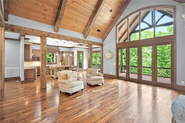 503 Greystoke Cv, Seneca, SC 29678 - living area with hardwood / wood-style floors, baseboards, beam ceiling, high vaulted ceiling, and wood ceiling