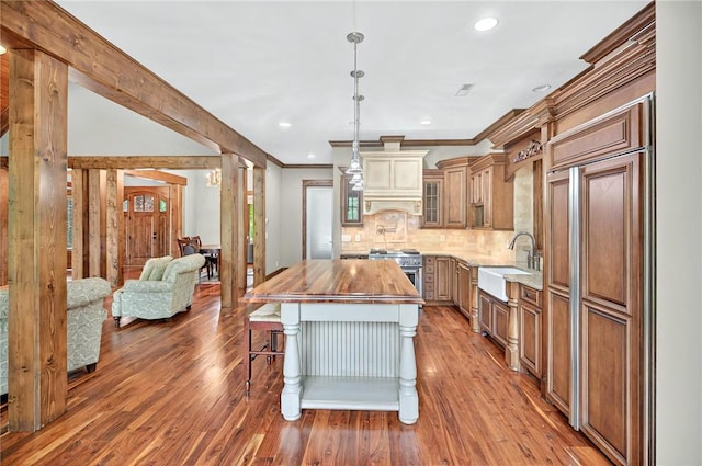 503 Greystoke Cv, Seneca, SC 29678 - kitchen featuring wooden counters, a sink, stainless steel range, wood finished floors, and a kitchen island