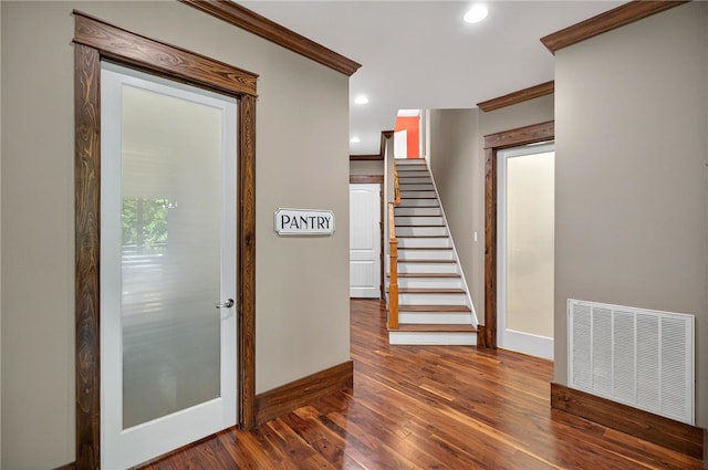 503 Greystoke Cv, Seneca, SC 29678 - entryway with crown molding, stairs, wood finished floors, baseboards, and recessed lighting