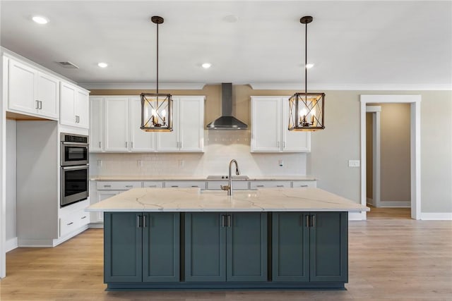 1004 Gaineswood Rd, Anderson, SC 29625 - kitchen with wall chimney range hood, double oven, white cabinetry, baseboards, and tasteful backsplash