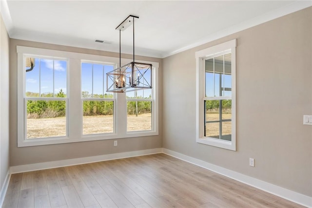 1004 Gaineswood Rd, Anderson, SC 29625 - unfurnished dining area featuring a chandelier, baseboards, and light wood-style flooring
