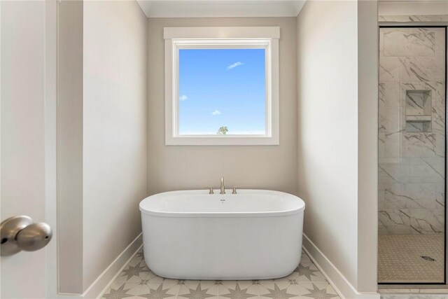 1004 Gaineswood Rd, Anderson, SC 29625 - bathroom featuring a shower stall, baseboards, and a freestanding tub