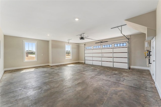 1004 Gaineswood Rd, Anderson, SC 29625 - garage with a garage door opener, baseboards, and recessed lighting