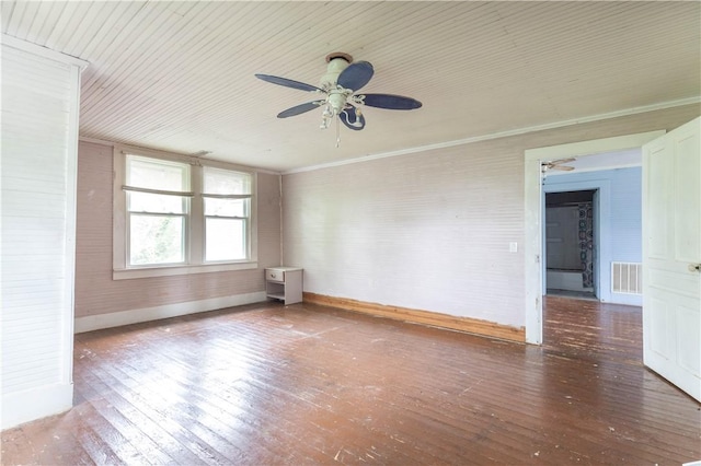 spare room with baseboards, ceiling fan, and hardwood / wood-style flooring