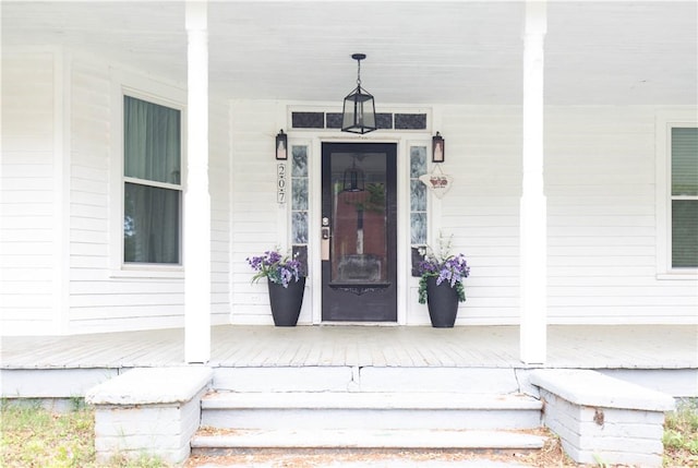 doorway to property with covered porch