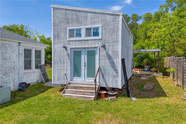 back of property featuring entry steps