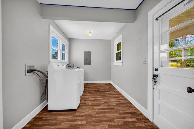 washroom featuring electric panel, baseboards, washing machine and clothes dryer, and dark wood-style floors