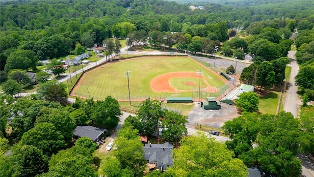 aerial view of property's location featuring a heavily wooded area