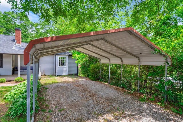 view of parking with a detached carport