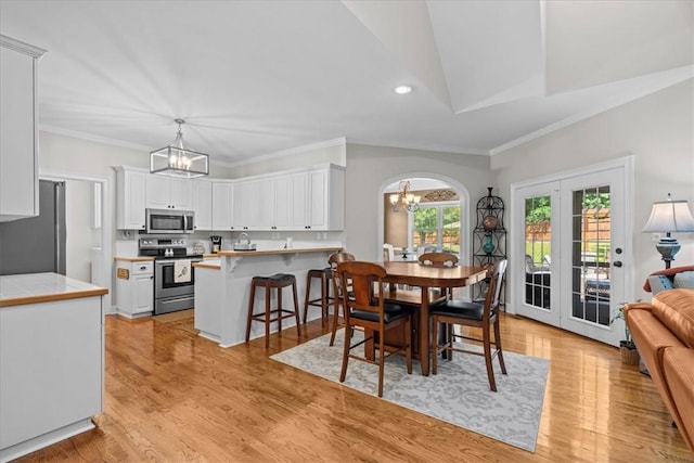 110 Red Maple Cir, Easley, SC 29642 - dining area with a chandelier, recessed lighting, ornamental molding, and light wood finished floors
