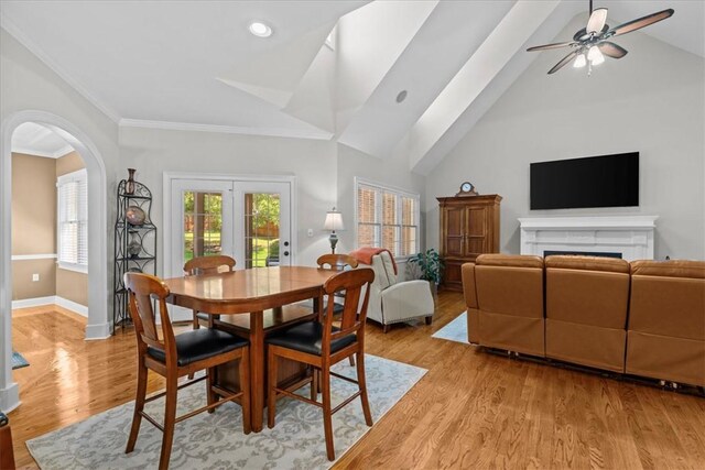 110 Red Maple Cir, Easley, SC 29642 - dining space featuring a fireplace, arched walkways, a ceiling fan, lofted ceiling, and ornamental molding