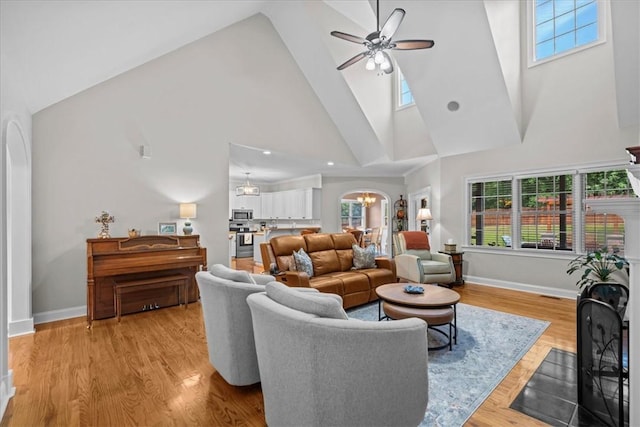 110 Red Maple Cir, Easley, SC 29642 - living room featuring high vaulted ceiling, ceiling fan, plenty of natural light, baseboards, and a chandelier