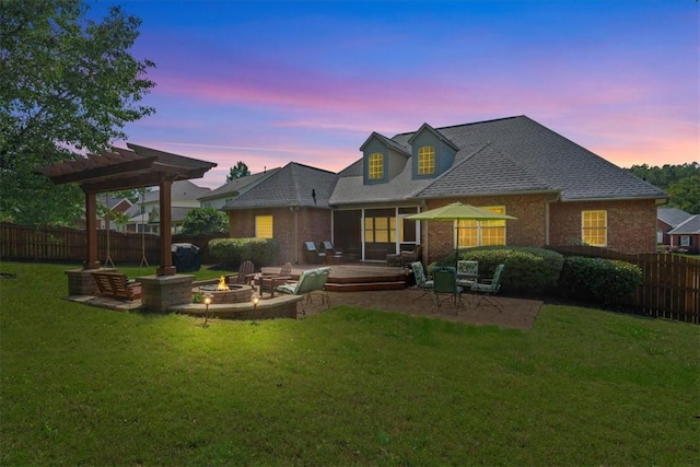 110 Red Maple Cir, Easley, SC 29642 - back of house at dusk with a fire pit, a patio area, a pergola, brick siding, and roof with shingles